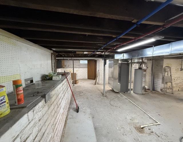 basement with heating unit and water heater