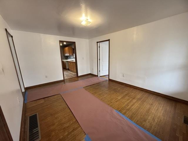 spare room featuring light hardwood / wood-style floors