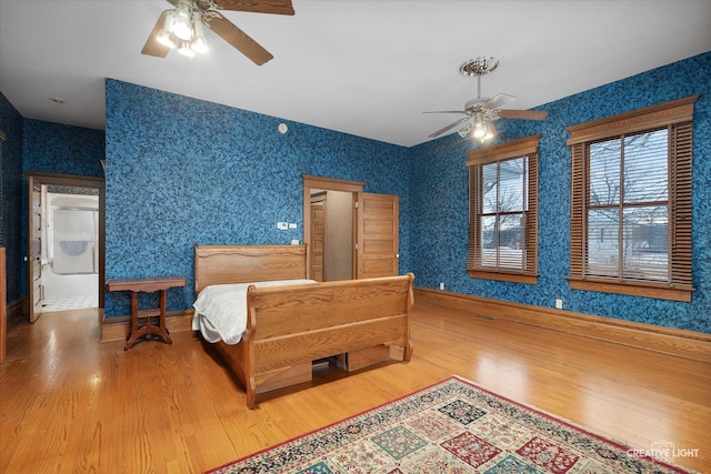 bedroom featuring ceiling fan and hardwood / wood-style flooring