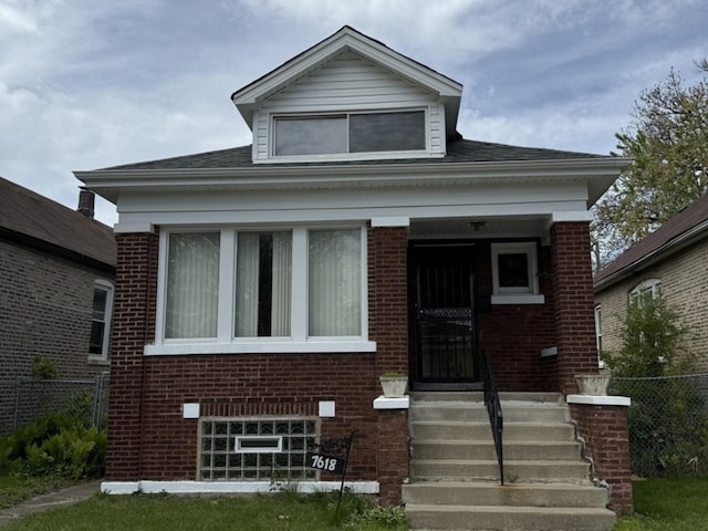 7618 S Rhodes Ave, Chicago, IL 60619 - bungalow-style home with brick siding and fence