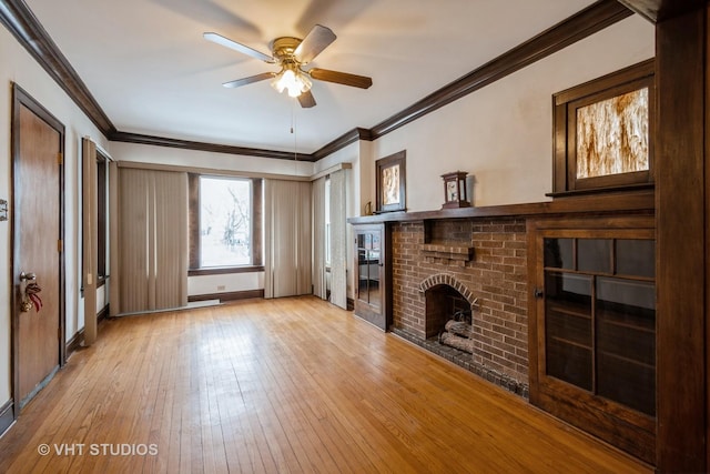 unfurnished living room featuring ceiling fan, a fireplace, crown molding, and light hardwood / wood-style flooring