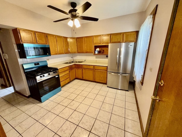 7618 S Rhodes Ave, Chicago, IL 60619 - kitchen featuring appliances with stainless steel finishes, a sink, brown cabinets, and decorative backsplash