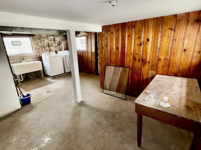 7618 S Rhodes Ave, Chicago, IL 60619 - below grade area with washing machine and dryer, a sink, and wooden walls