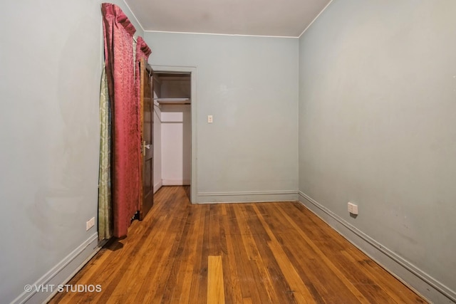 unfurnished bedroom with hardwood / wood-style floors