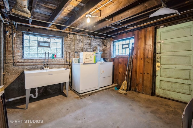 basement with washing machine and clothes dryer