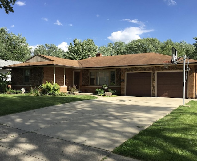 single story home featuring a garage and a front lawn