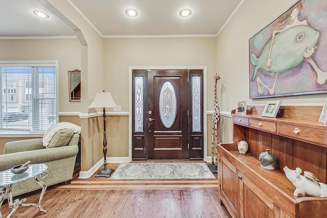 entrance foyer featuring hardwood / wood-style floors and ornamental molding