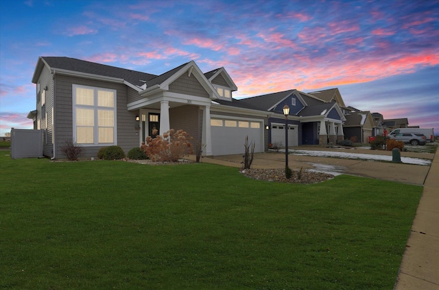 craftsman-style house with a lawn and a garage