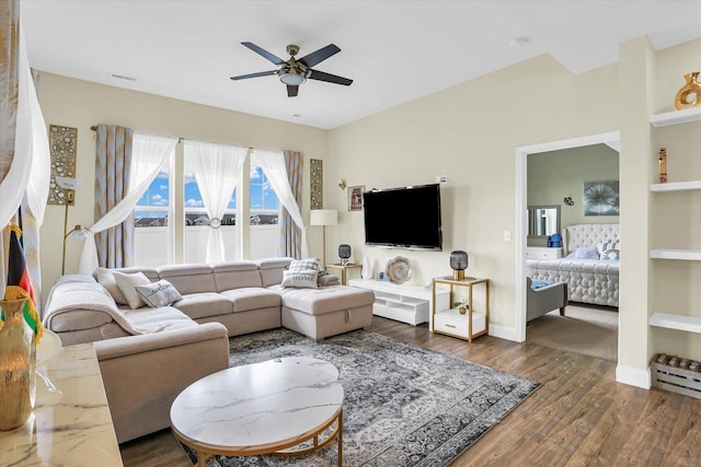 living room with dark hardwood / wood-style floors and ceiling fan