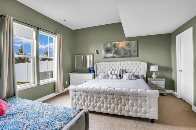 bedroom with light colored carpet