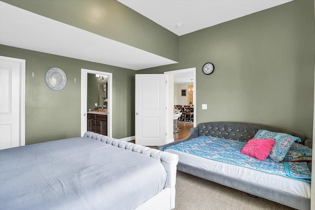 bedroom with carpet flooring and ensuite bathroom