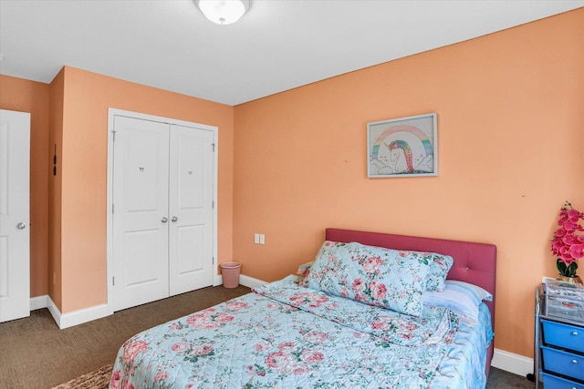 bedroom featuring a closet and dark carpet