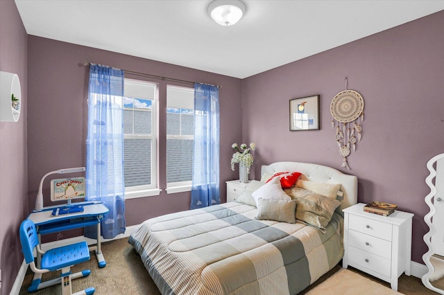 bedroom featuring light carpet