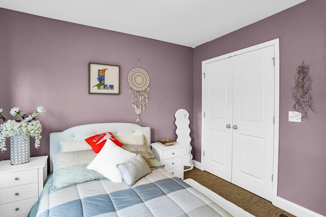 bedroom with a closet and carpet