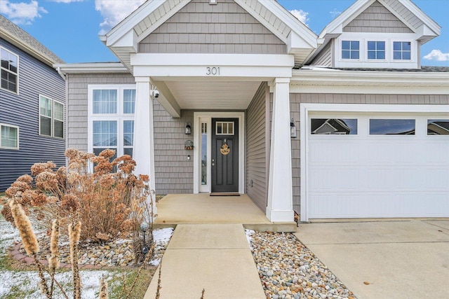 doorway to property featuring a garage