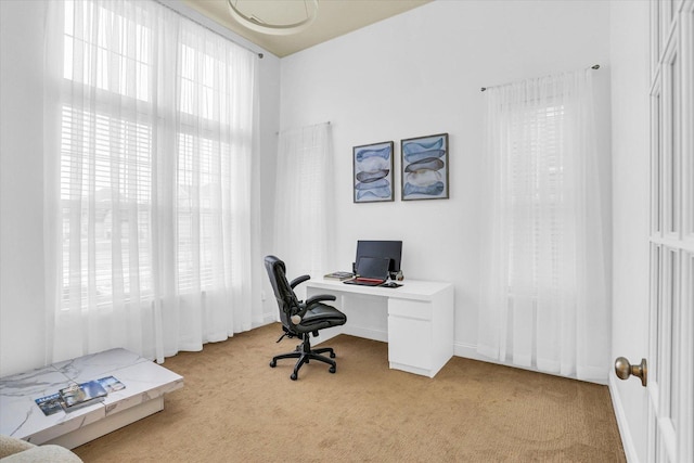 office area featuring light colored carpet