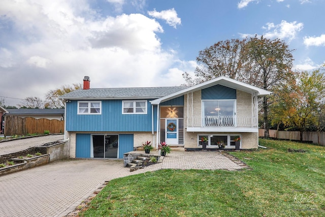 view of front of property with a patio area and a front yard