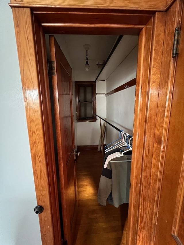 corridor with dark hardwood / wood-style floors