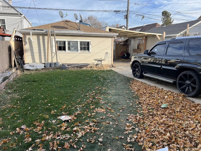 view of side of home with a lawn