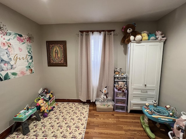 playroom with light hardwood / wood-style floors