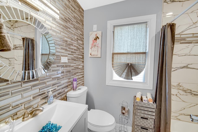 full bathroom with vanity, tasteful backsplash, toilet, and shower / bath combo with shower curtain