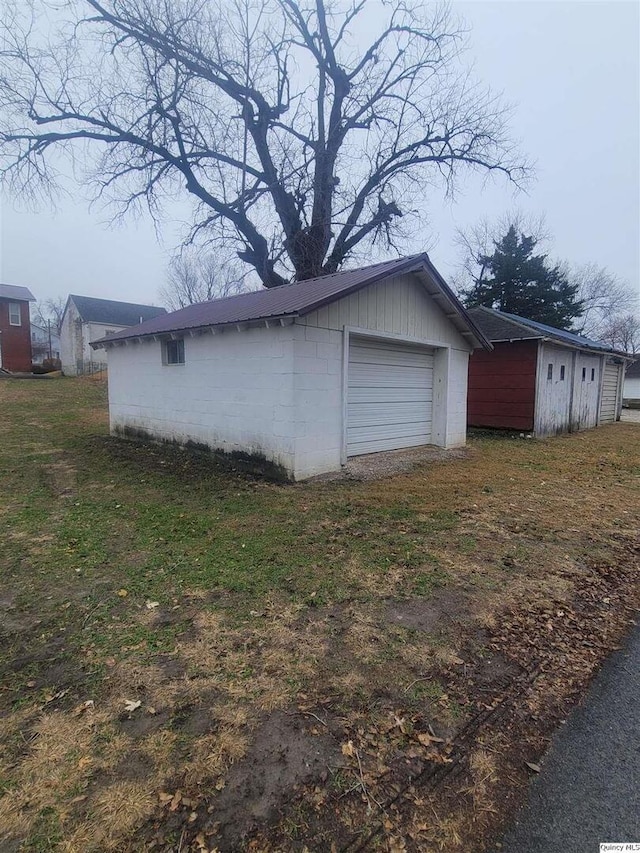 view of side of home featuring a garage