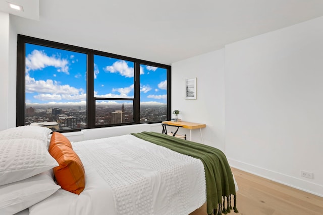 bedroom with light wood-type flooring