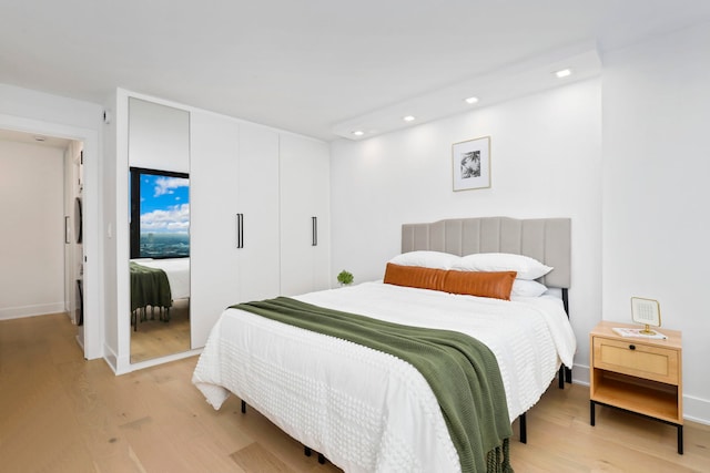 bedroom with a closet and light wood-type flooring