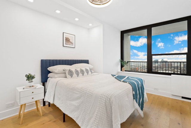 bedroom with light hardwood / wood-style flooring