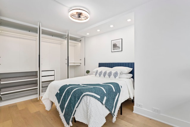 bedroom featuring light wood-type flooring