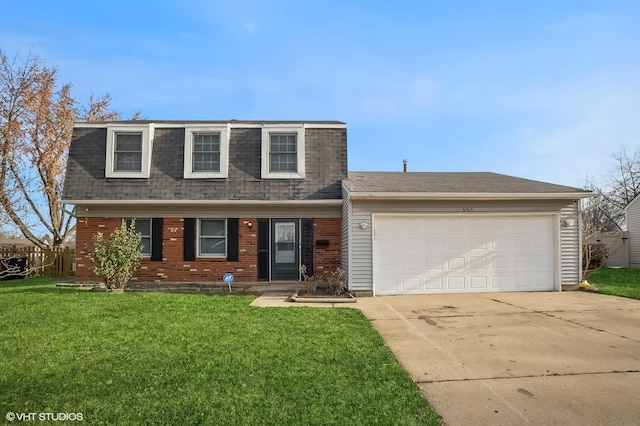 view of front of property with a front yard and a garage