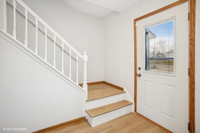 entryway with hardwood / wood-style flooring