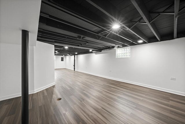 basement featuring dark wood-type flooring