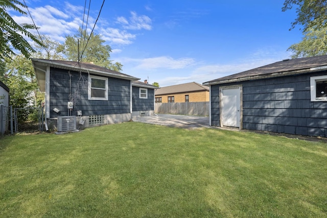 view of yard featuring central AC and a patio area