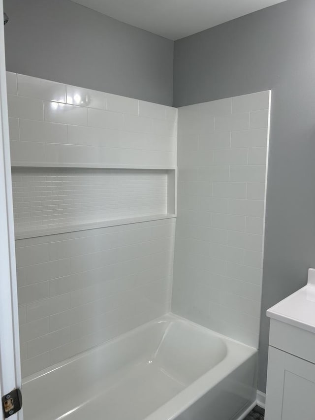 bathroom featuring vanity and shower / tub combination