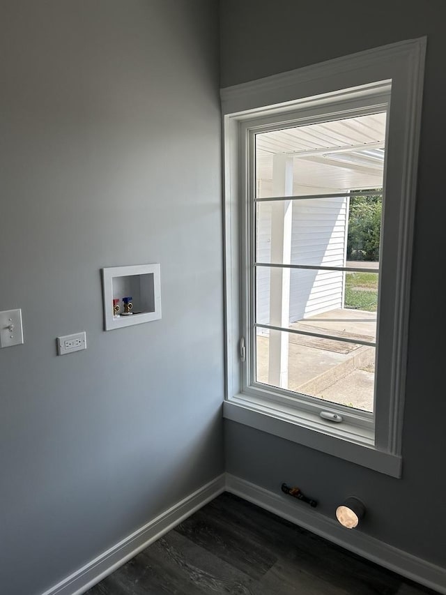 laundry area with hookup for a washing machine and dark wood-type flooring