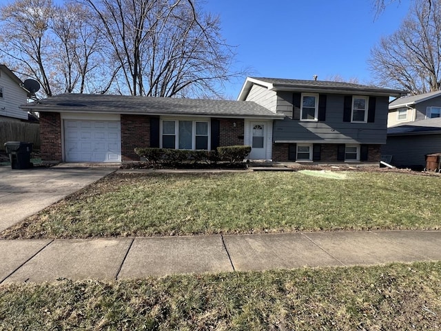 split level home featuring a garage and a front lawn