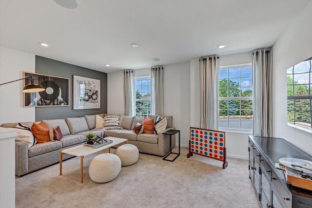 living room with light carpet and plenty of natural light