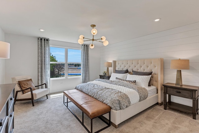 carpeted bedroom featuring a notable chandelier