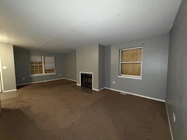 unfurnished living room featuring carpet floors