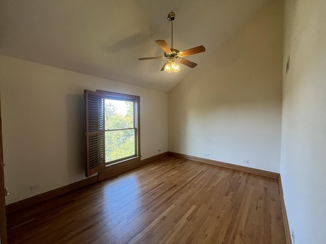 spare room with light hardwood / wood-style flooring, ceiling fan, and lofted ceiling