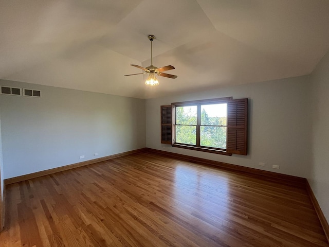 unfurnished room featuring ceiling fan, wood-type flooring, and vaulted ceiling