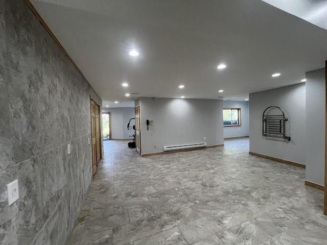 interior space featuring a baseboard radiator and tile walls