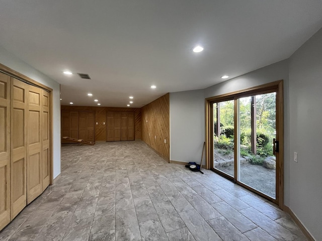 interior space featuring wood walls