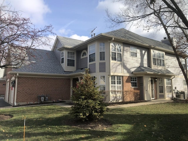 rear view of house with a lawn