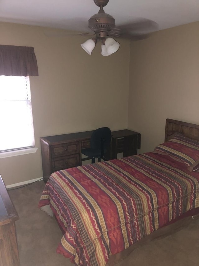 bedroom featuring ceiling fan and carpet floors