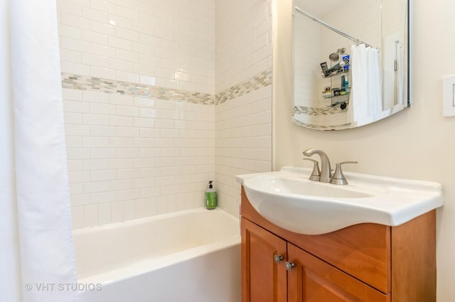 bathroom with vanity and shower / bathtub combination with curtain