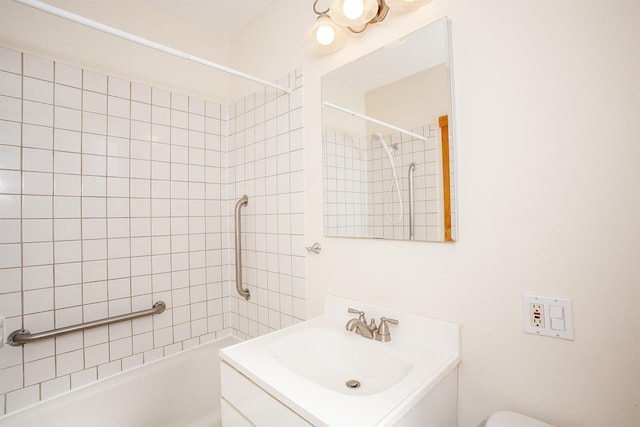 bathroom with shower / bath combination, toilet, and vanity