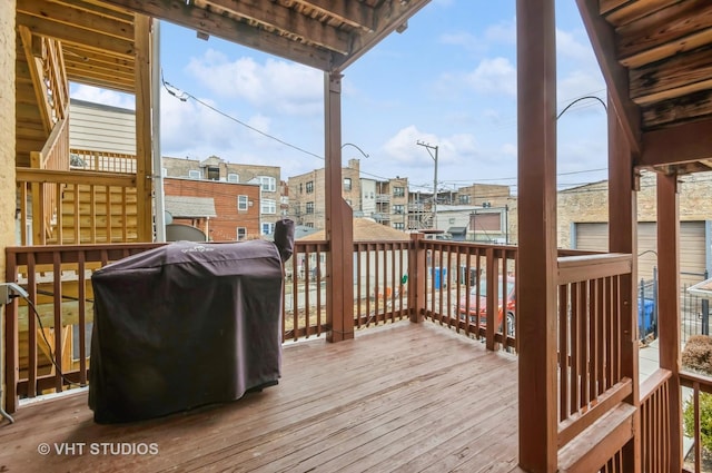 deck featuring a residential view and grilling area