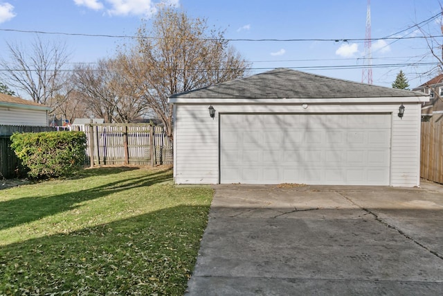 garage featuring a lawn